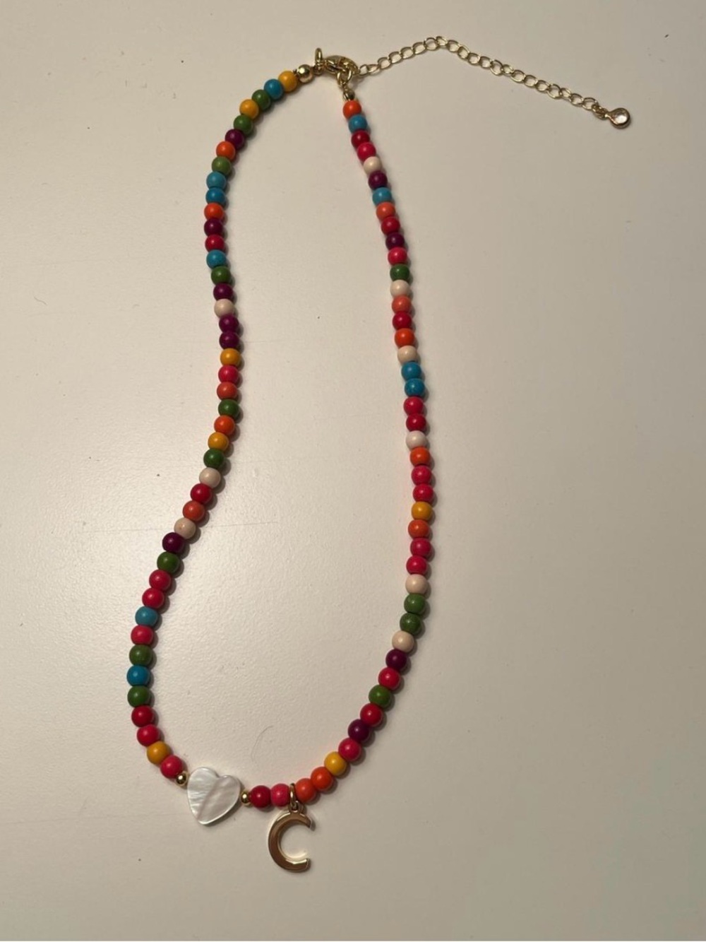Multicolor Beaded Necklace with Gold 'C' Charm and Mother-of-Pearl Heart